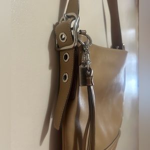 Tan Coach tassel/buckle keychain bag